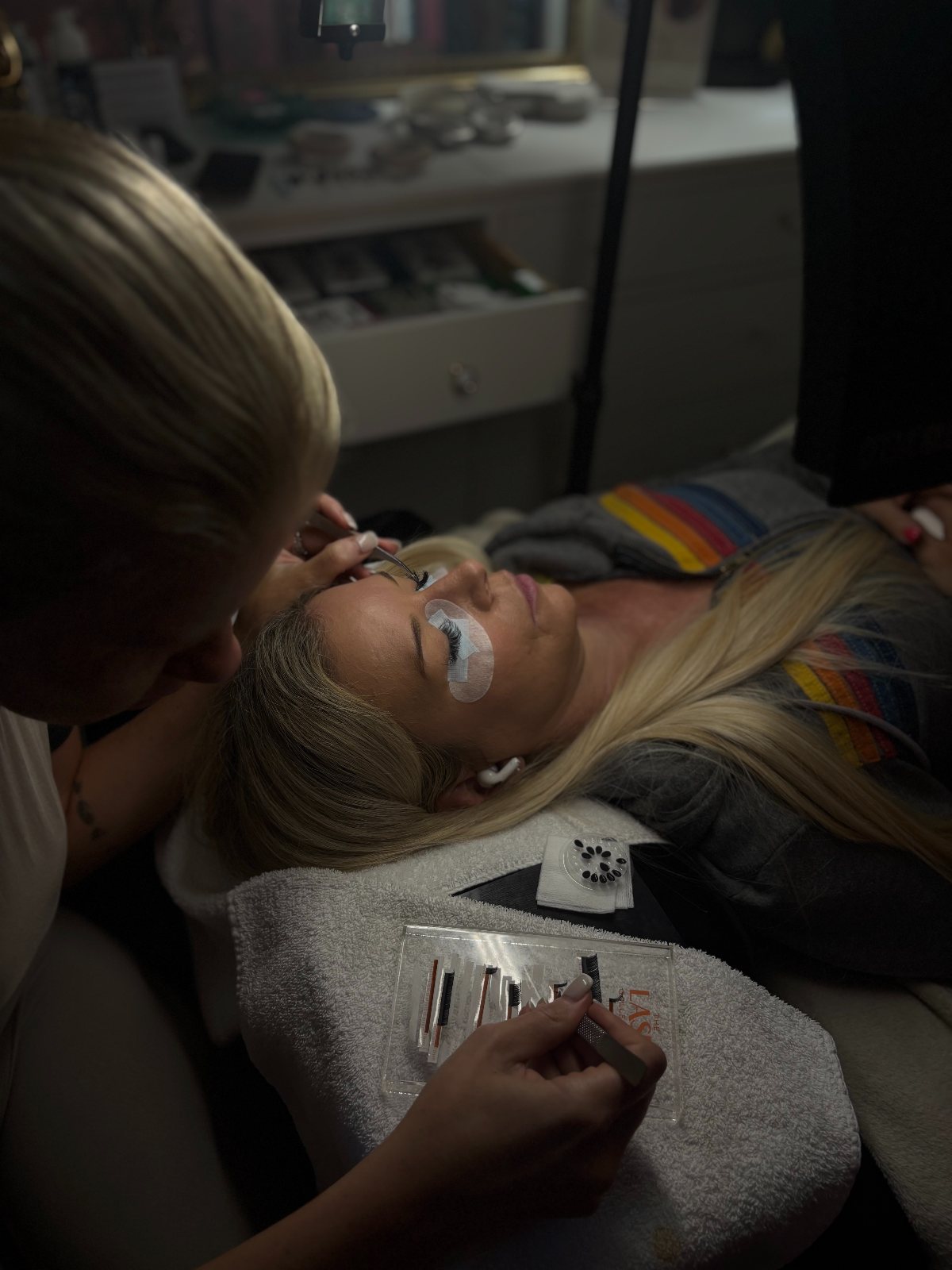 Snowbird regular, lash appointment scene — The Bronze Lily, St. Petersburg, FL