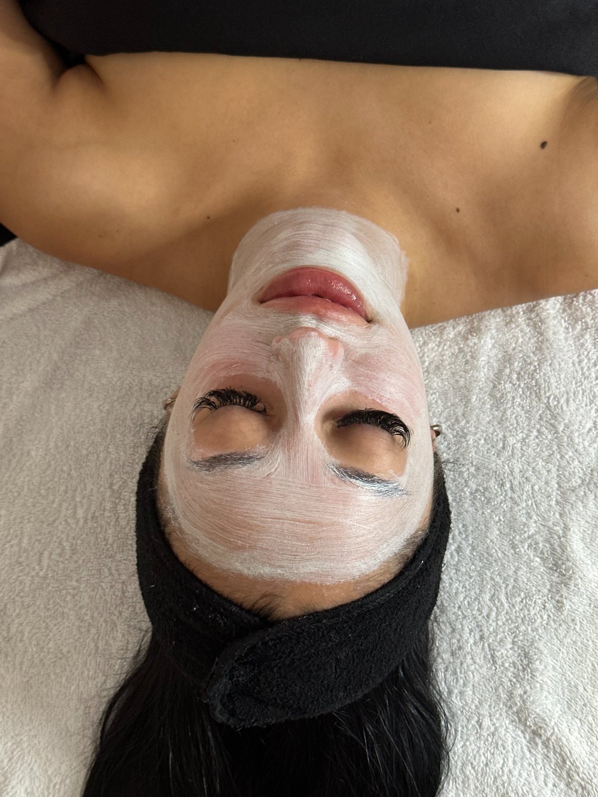 The Amara Ritual, Meg working with warm stones — The Bronze Lily, St. Petersburg, FL